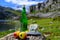 Green bottle and glass of natural Asturian cider made fromÂ fermented apples, Asturian cabrales cow blue cheese with view on